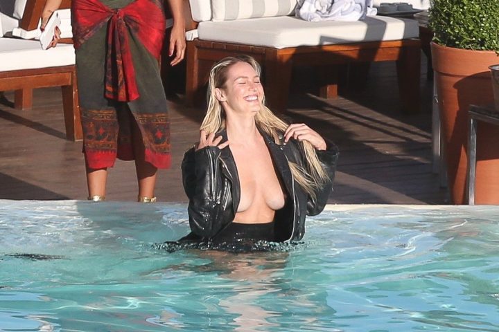 Candice Swanepoel flashes her tits during a photo shoot in Rio de Janeiro