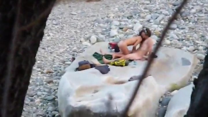 Nude horny couple at the river