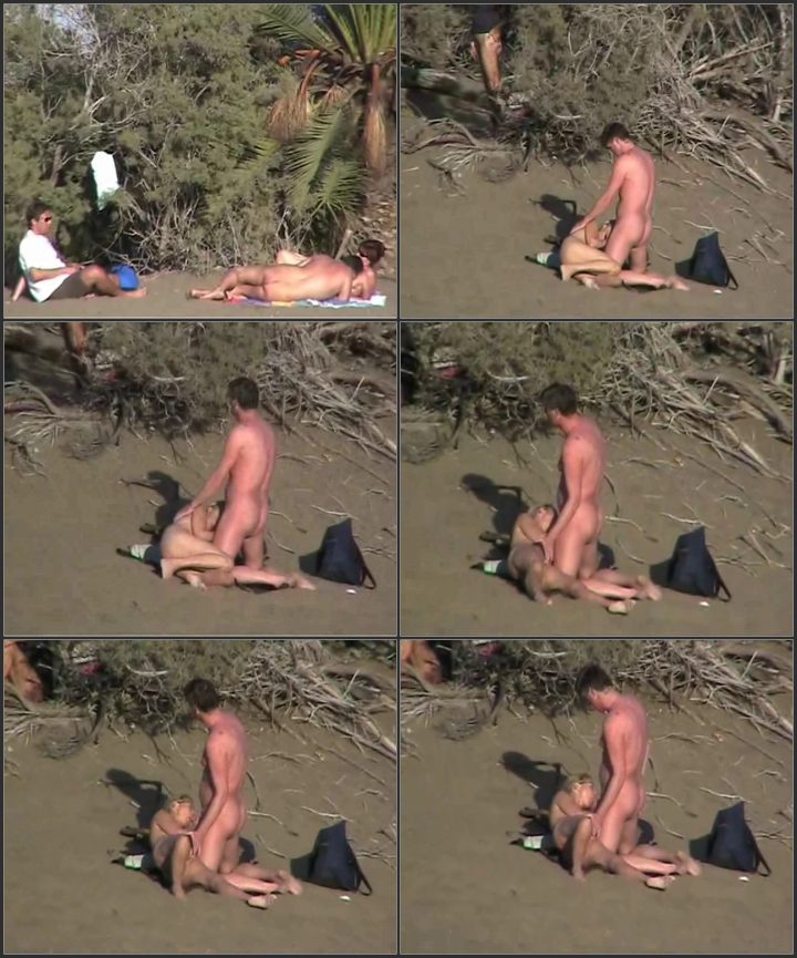 A blowjob on the crowded beach