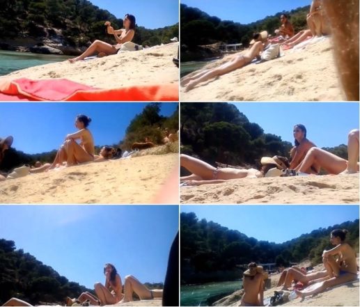 Two out of three friends enjoy topless on beach