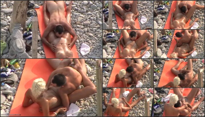 Horny couple voyeured on the beach