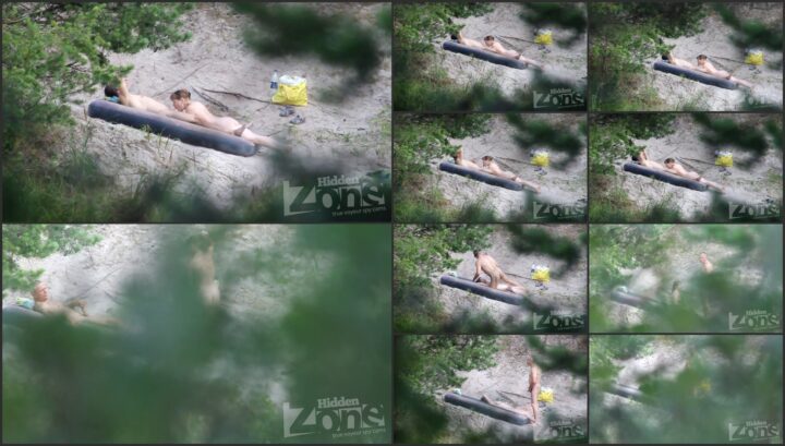 A blowjob on the crowded beach