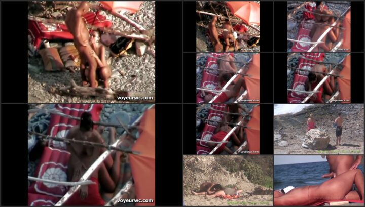 Nudist couple relaxes at the beach